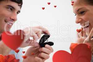 Composite image of close up of man making a proposal of marriage
