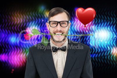 Composite image of geeky hipster holding rose between teeth