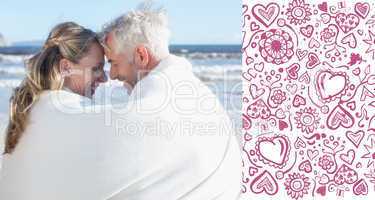 Composite image of couple sitting on the beach under blanket smi