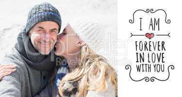 Composite image of attractive couple on the beach in warm clothi