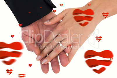 Composite image of close-up of bride and groom with hands togeth