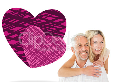 Composite image of happy man giving his partner a piggy back Composite image of happy man giving his partner a piggy back