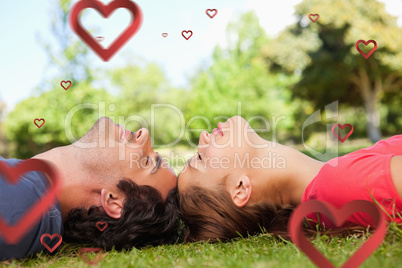 Composite image of two friends with their eyes closed while lyin