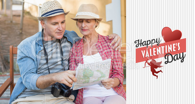 Composite image of happy tourist couple looking at map on a benc