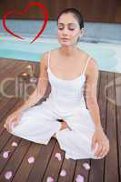 Composite image of peaceful brunette in white sitting in lotus p