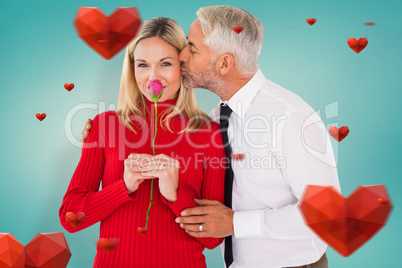 Composite image of handsome man giving his wife a kiss on cheek