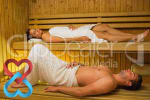 Composite image of calm couple relaxing in a sauna