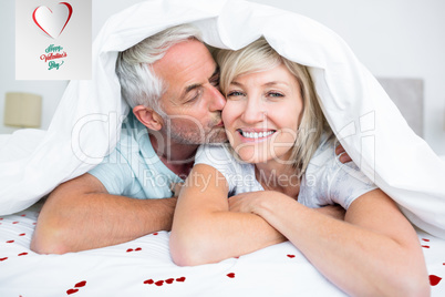 Composite image of closeup of mature man kissing womans cheek in