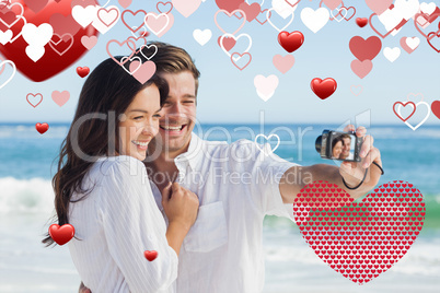 Composite image of happy couple taking a photo