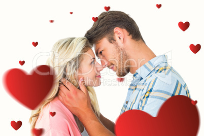 Composite image of attractive couple smiling at each other