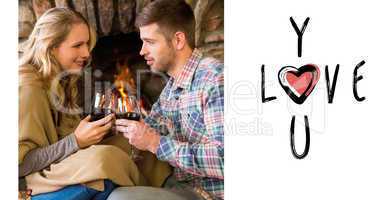 Composite image of couple toasting wineglasses in front of lit f
