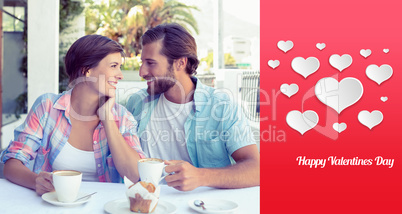 Composite image of happy couple enjoying coffee together