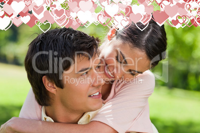 Composite image of woman looking at her friend while he is carry