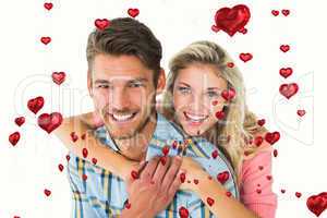 Composite image of attractive couple embracing and smiling at ca