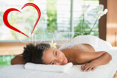 Composite image of gorgeous woman lying on massage table with sa