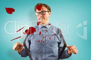 Composite image of geeky hipster covered in kisses