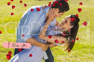 Composite image of loving and happy couple dancing in park