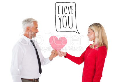 Composite image of handsome man getting a heart card form wife