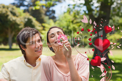 Composite image of man watching his friend while she is smelling