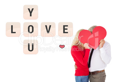 Composite image of handsome man getting a heart card form wife