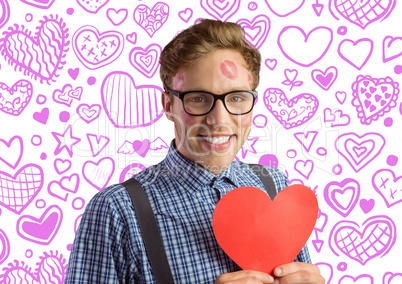 Composite image of geeky hipster covered in kisses