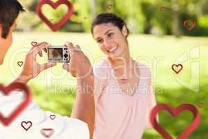 Composite image of man takes a photo of his smilng friend