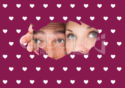 Composite image of young couple peeking through torn paper