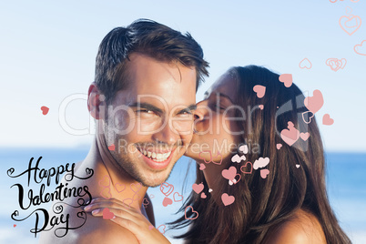 Composite image of attractive woman kissing her boyfriend on the