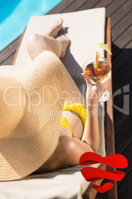 Composite image of beautiful woman holding drink by swimming poo