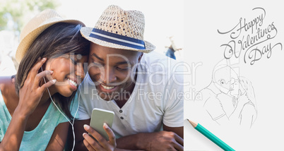 Composite image of happy couple lying in garden together listeni