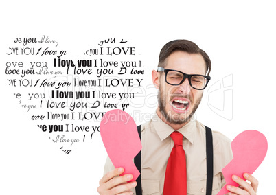 Composite image of geeky hipster crying and holding broken heart