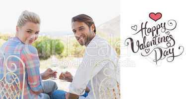 Composite image of happy young couple sitting in the garden enjo