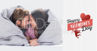 Composite image of couple wrapped in the duvet