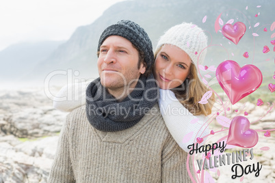 Composite image of romantic young couple together on a rocky lan