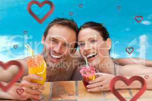 Composite image of beautiful couple drinking cocktails in the sw
