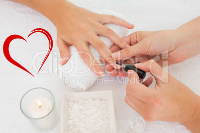 Composite image of nail technician painting customers nails
