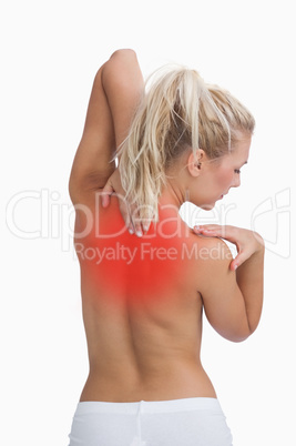 Rear view of topless woman with neck pain