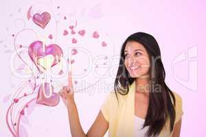 Composite image of happy casual woman pointing up