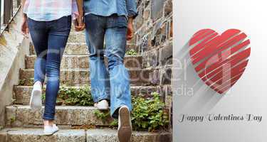 Composite image of hip young couple walking up steps