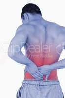 Young male suffering from back pain