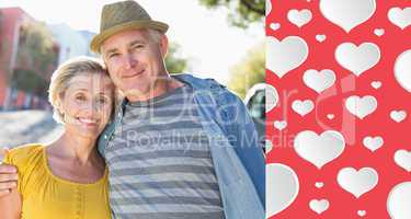 Composite image of happy mature couple smiling at camera in the