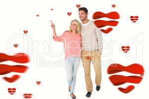 Composite image of attractive couple smiling and walking