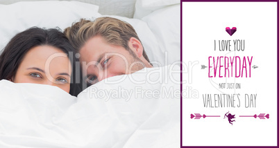 Composite image of couple hiding under the duvet