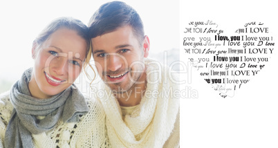 Composite image of close up portrait of a loving couple in winte
