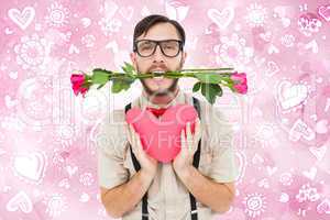 Composite image of geeky hipster offering valentines gifts