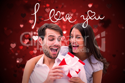 Composite image of woman surprising boyfriend with gift