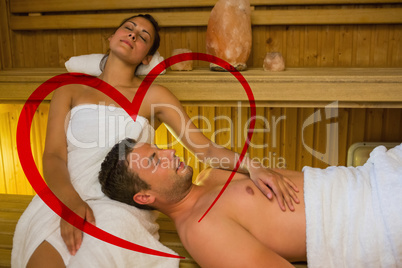 Composite image of loving couple relaxing in a sauna