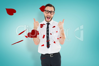 Composite image of geeky young man showing thumbs up