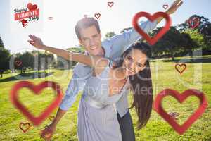 Composite image of happy couple with arms outstretched at park