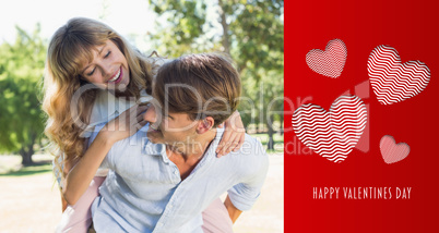 Composite image of man giving his pretty girlfriend a piggy back